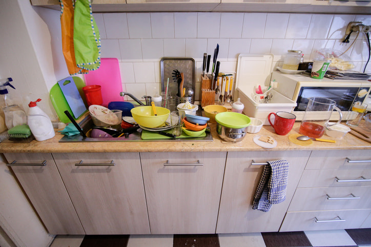 Messy kitchen with small workspace